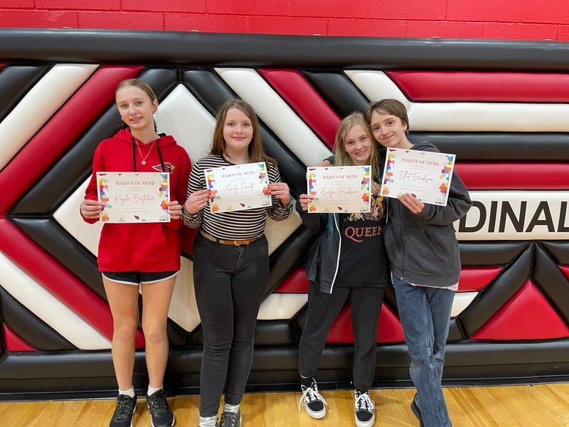 students posing with certificates