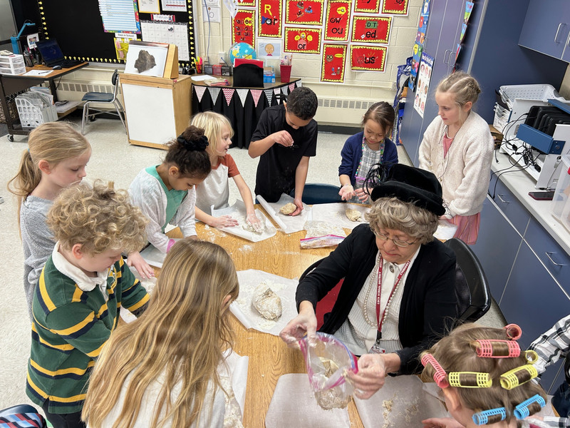 first grade students making bread